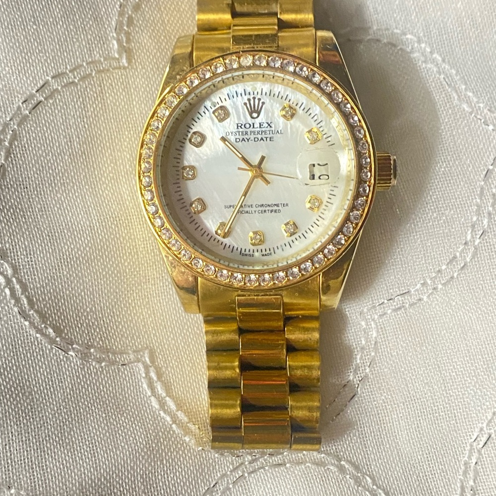 Princess Rolex Gold and White Mother-of-Pearl Dial Watch with Crystal Bezel